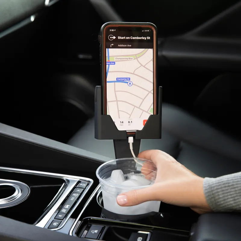 Phone in a case in Cell Phone Seat, with a drink in the same cup holder